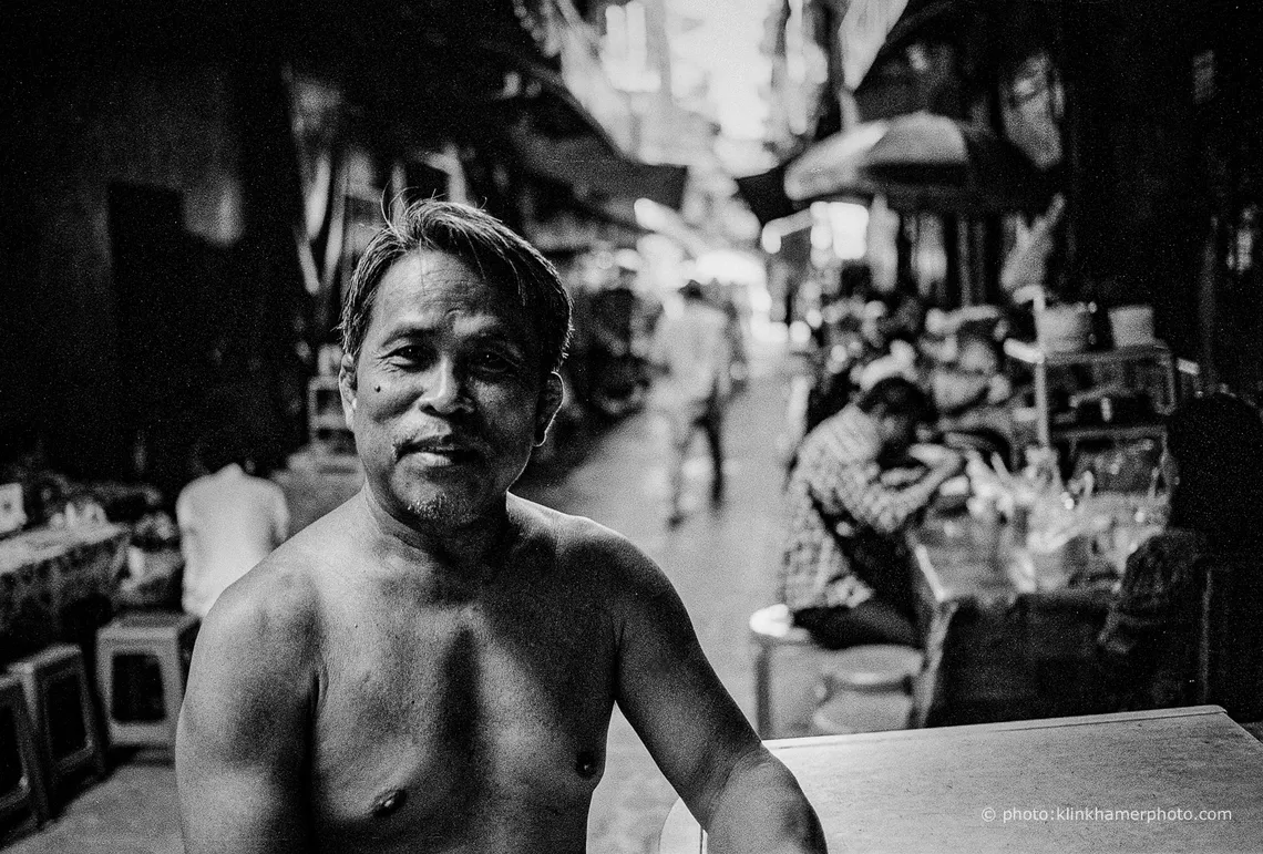 Portrait of a market vendor in Phnom Penh, black and white