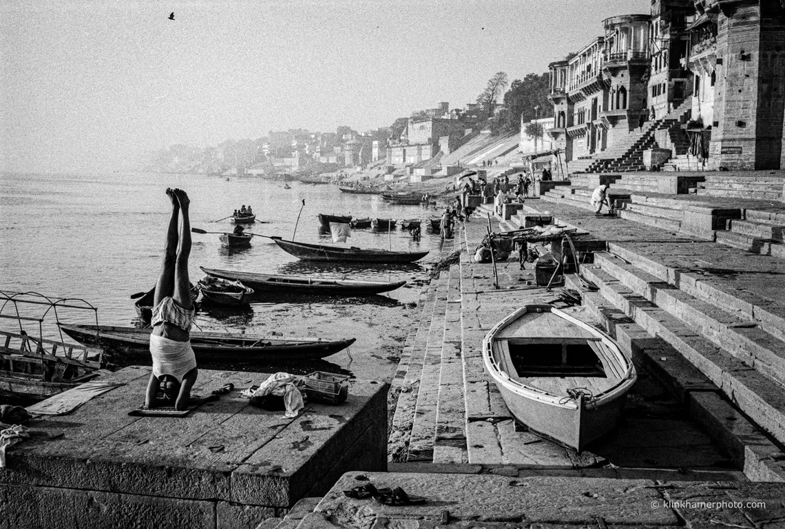 Wooden boats moored along the riverside in Phnom Penh, black and white